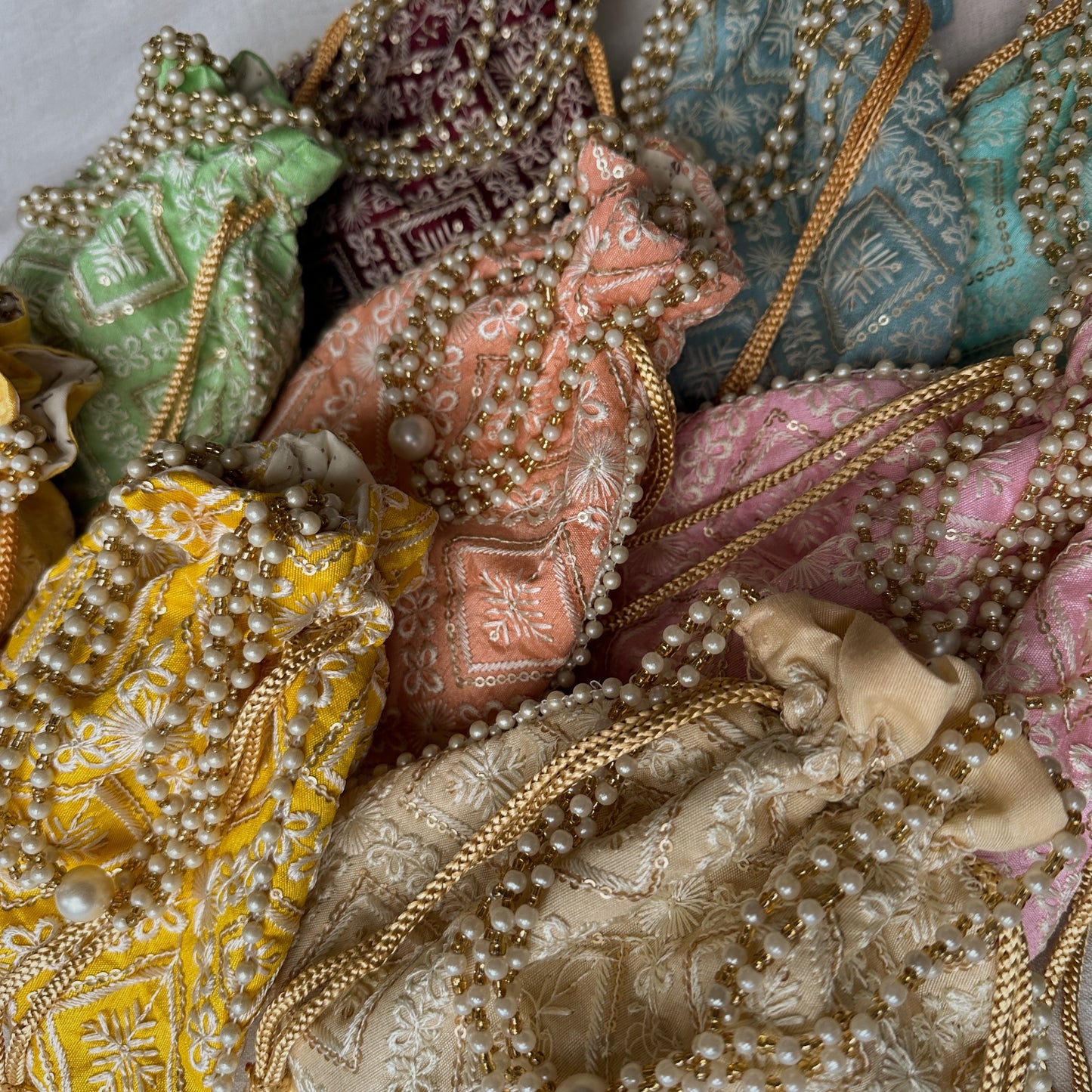 Intricate Chikankari Embroidered Potli Bags